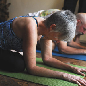 Baby boomers practicing yoga.