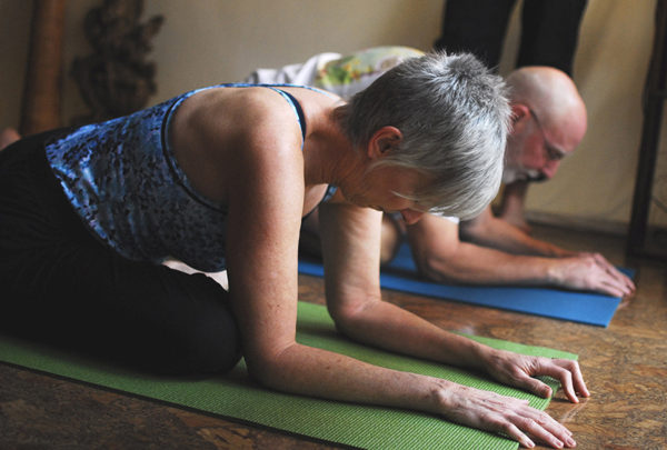 Baby boomers practicing yoga.